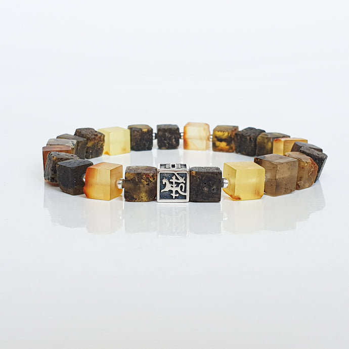 Bracelet with brown and yellow square beads on a white background