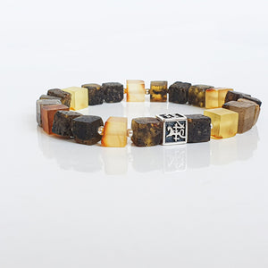 Bracelet with multicolored Baltic amber square beads on a white background with Vytis