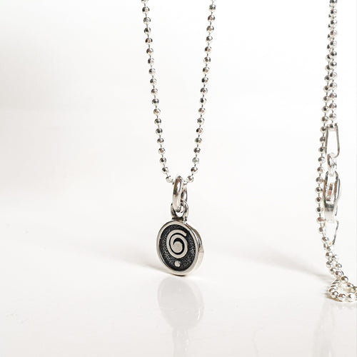 Necklace with a pendant on a white background