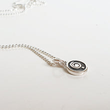 Load image into Gallery viewer, Silver necklace with a spiral pendant on a white background
