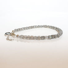 Load image into Gallery viewer, Beaded bracelet with a chain on a light background